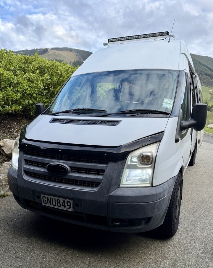 Front-on view of the Transit showing the bonnet protector and roof light bar